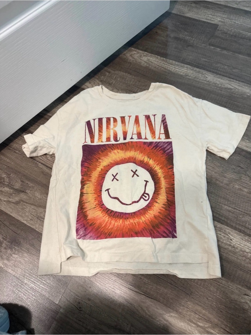 NIRVANA Cream Kids Short Sleeve Tee with Orange & Purple Sunburst Smiley